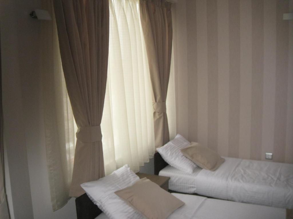 Domus Aparthotel Escópia Quarto foto